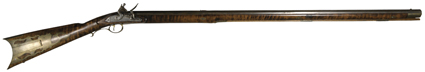 [Gun - Flintlock rifle] A beautiful early 19th-century flintlock rifle by Gilbert of Rochester. Octagonal 38.5-inch barrel, with full-length stock, wooden ramrod. Gilbert
Rochester stamped on top of barrel. With lock-maker J.M. Caswell  Lan