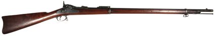 [Rifle - Springfield Model 1873] trapdoor breech-loading rifle. Serial number 417020. Overall length 52, barrel 31.5. With natural field wear, and one (probably later) chip in
stock. Includes bayonet, making it a certainty that this was issued
