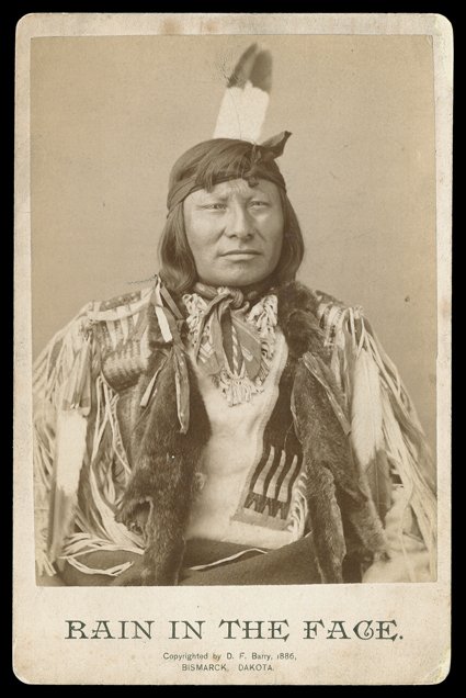 [Rain-in-the-Face] Cabinet card Photograph of Chief Rain-in-the-Face, by D. Barry, Bismarck, Dakota, 1886. Toned, with minor edge wear and a few small scratches, but in
beautiful condition.