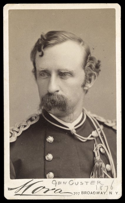 [George Armstrong Custer] Choice date carte-de-visite Photograph by Mora of New York. A head-and-shoulders close-up of the fierce Indian-fighter as lieutenant colonel, in his
elaborate gold braid dated in pencil on lower mount as Gen. Custer 