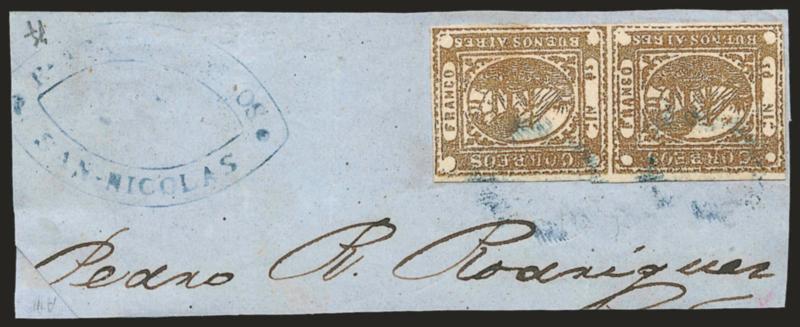 1858, 1p (In Ps) Light Brown (1).> Horizontal pair, gorgeous bright color, full to large margins (clear at left), tied by two light strikes of blue <<ponchito>> cancel, matching Renta de Correos San-Nicolas
double-oval handstamp on blue piece<><